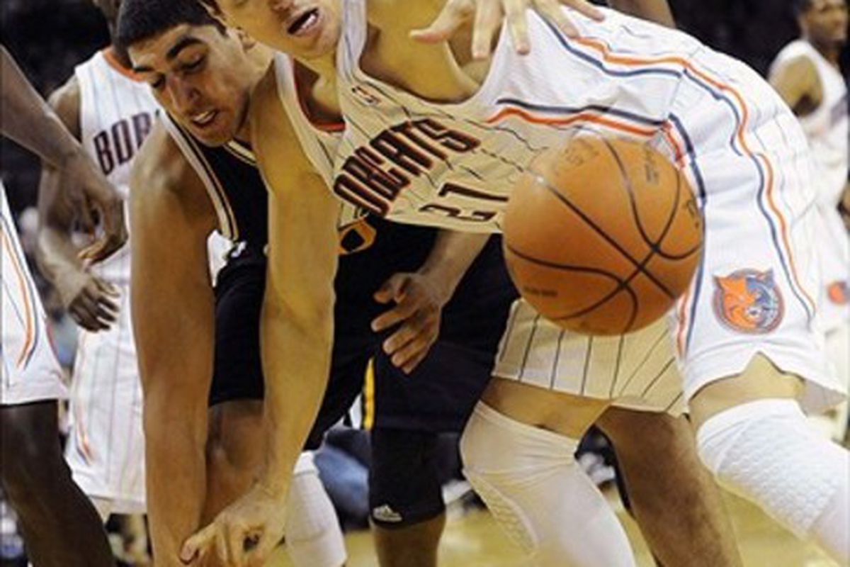 March 7, 2012; Charlotte, NC, USA; Charlotte Bobcats forward Eduardo Najera (21) goes after a loose ball during the game against the Utah Jazz at Time Warner Cable Arena. Jazz win 99-93. Mandatory Credit: Sam Sharpe-US PRESSWIRE