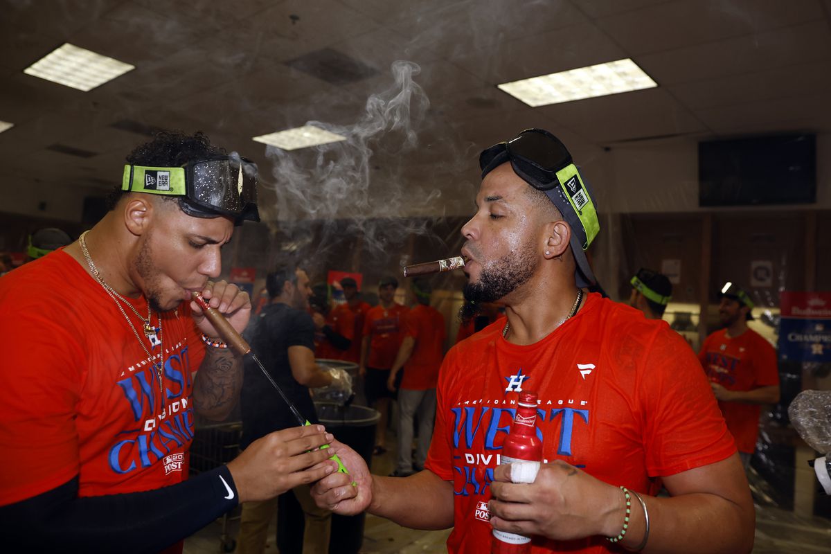 Bryan Abreu and Jose Abreu of the Houston Astros celebrate after the Astros defeated the Arizona Diamondbacks 8-1 to win the American League West division title at Chase Field on October 01, 2023 in Phoenix, Arizona.