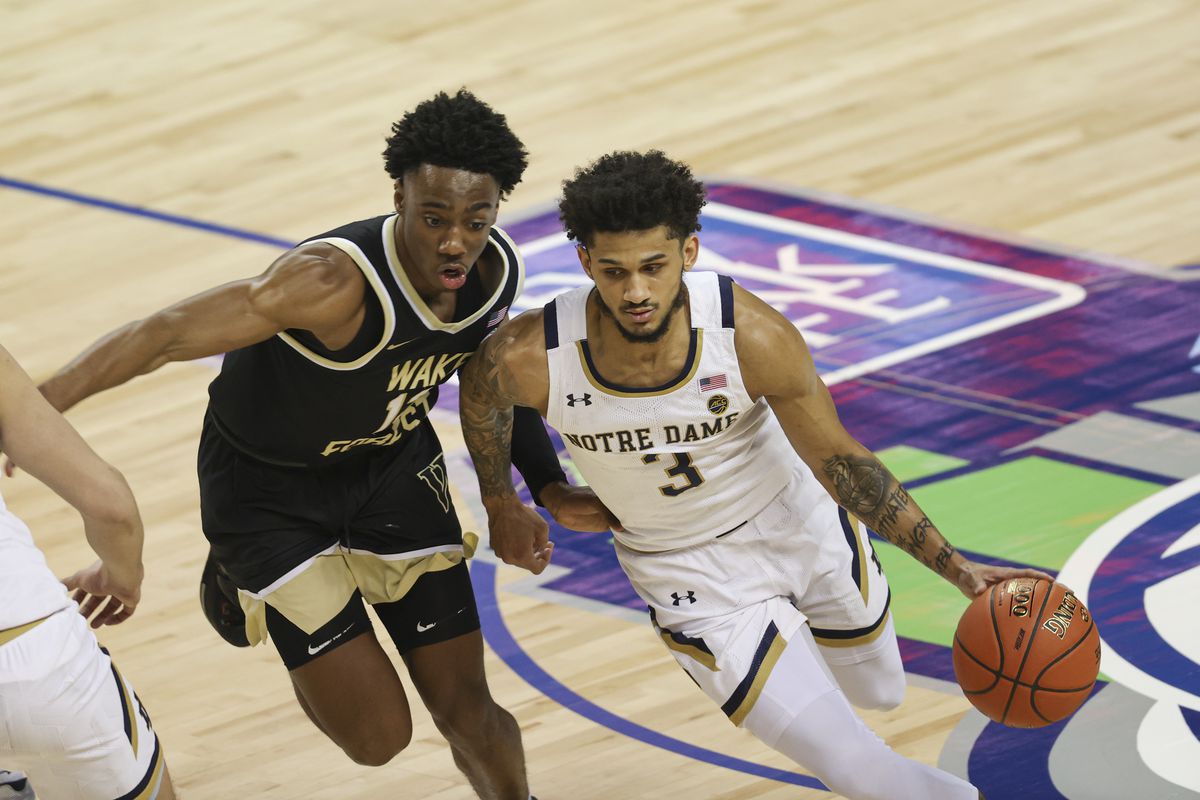 Notre Dame Fighting Irish guard Prentiss Hubb dribbles the ball past Wake Forest Demon Deacons guard Quadry Adams during the first half in the first round of the 2021 ACC men’s basketball tournament at Greensboro Coliseum.