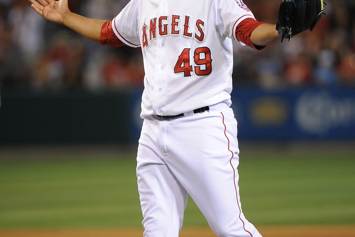 ANAHEIM, CA - JULY 22:  Pitcher Ernesto Frieri #49 of the Los Angeles Angels of Anaheim celebrates defeating the Texas Rangers 7-4 at Angel Stadium of Anaheim on July 22, 2012 in Anaheim, California.  (Photo by Lisa Blumenfeld/Getty Images)