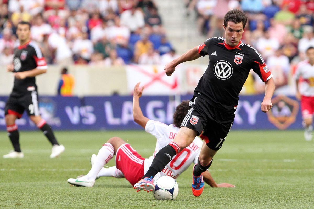 Jun 24, 2012; Harrison, NJ, USA;  D.C. United midfielder/forward Chris Pontius (13) takes the ball from New York Red Bulls midfielder Mehdi Ballouchy (10) during the first half at Red Bulls Arena.  Mandatory Credit: Anthony Gruppuso-US PRESSWIRE