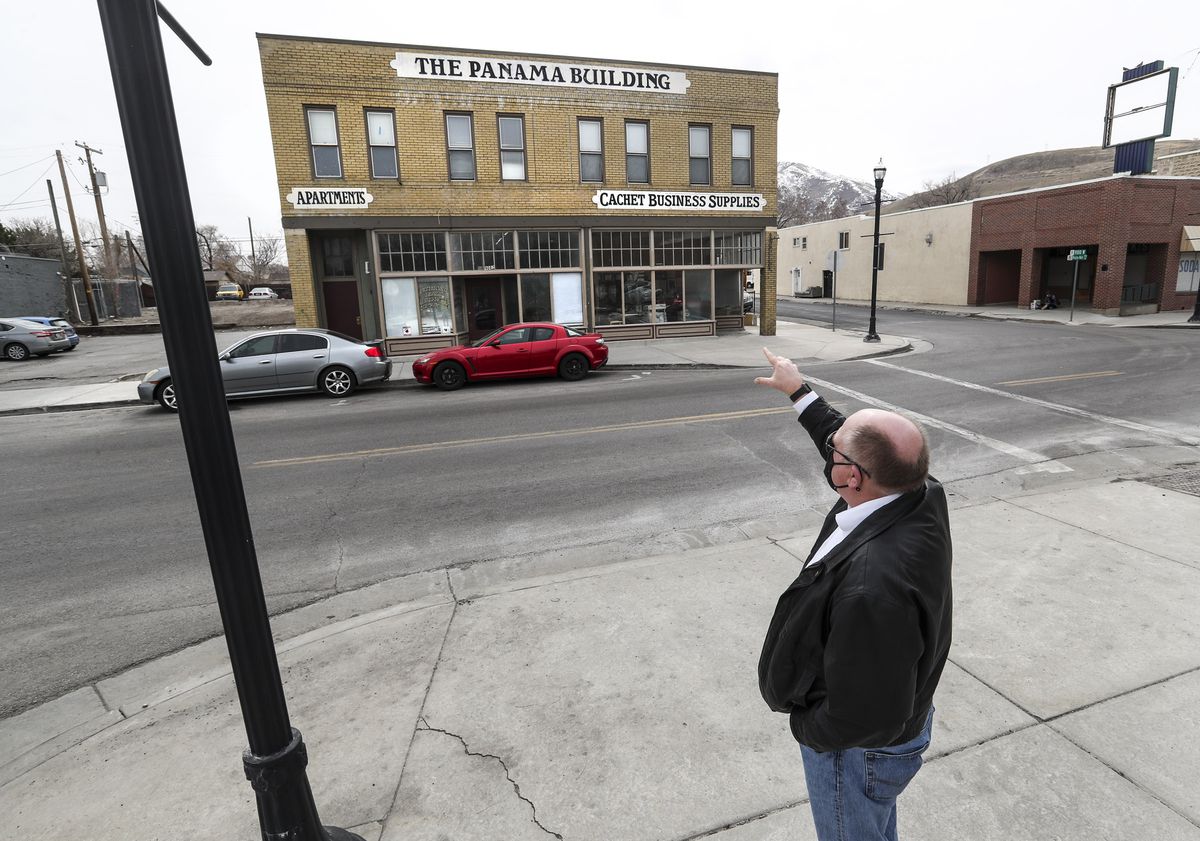 Greg Schulz, municipal administrator of the Magna Metro Township, points out repairs on the Panama Building on Magna’s Main Street on Tuesday, March 9, 2021. The building, as well as many others on the street, were damaged in a 5.7 magnitude earthquake on March, 18, 2020. Most of the buildings have since been repaired.