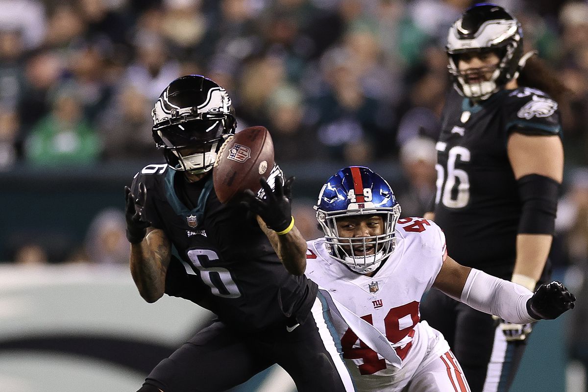 DeVonta Smith #6 of the Philadelphia Eagles catches a pass in front of Tomon Fox #49 of the New York Giants during the third quarter at Lincoln Financial Field on January 08, 2023 in Philadelphia, Pennsylvania.