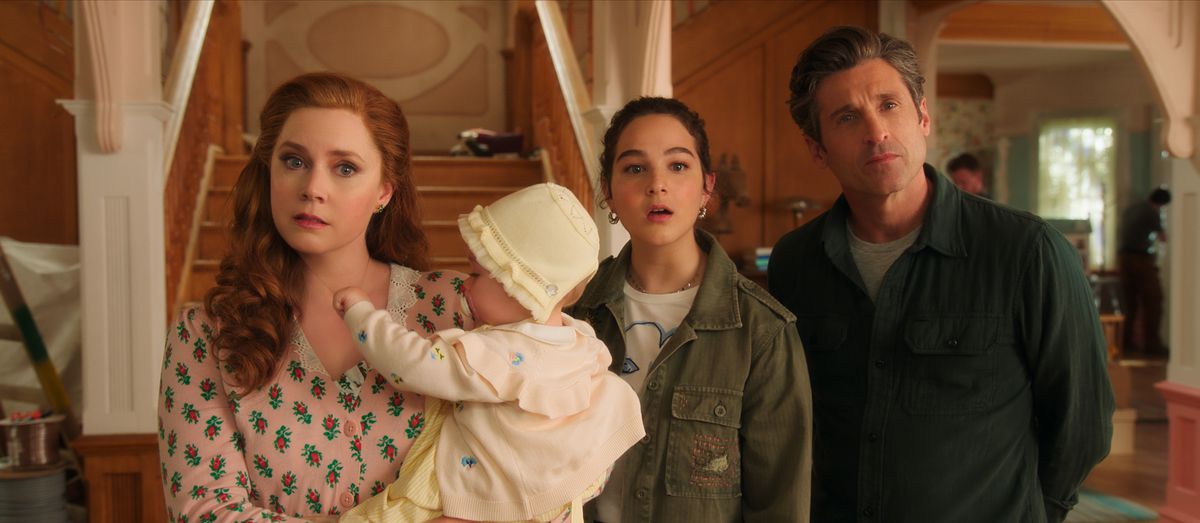giselle, a redhead woman, holds a baby. next to her is her teenage stepdaughter morgan and her husband robert. they all look confused