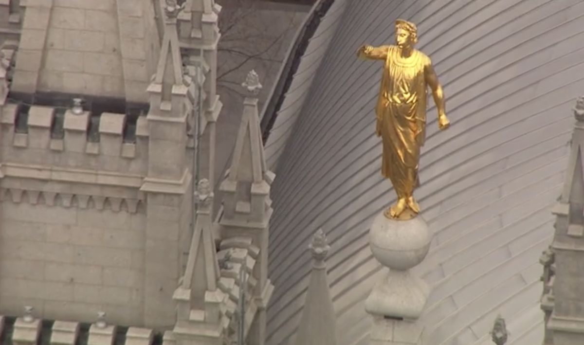 The Angel Moroni statue atop the Salt Lake Temple of The Church of Jesus Christ of Latter-day Saints stands with its trumpet missing after an earthquake in Salt Lake City on Wednesday, March 18, 2020.