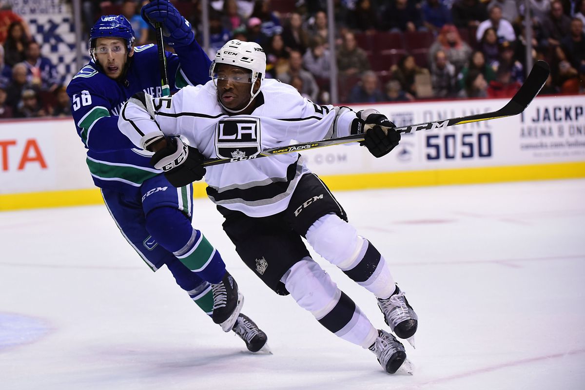 Sep 20, 2018; Vancouver, British Columbia, CAN; Los Angeles Kings forward Boko Imama (55) skates against Vancouver Canucks defenseman Guillaume Brisebois (56) during the second period at Rogers Arena.