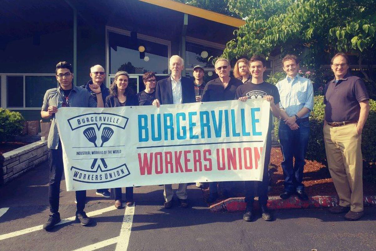 Several people standing with a Burgerville Workers Union sign.