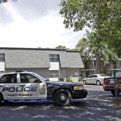 Fort Pierce police officers block one of the entrances to an apartment complex possibly linked to the fatal shootings at an Orlando nightclub, Sunday, June 12, 2016, in Fort Pierce, Fla. 