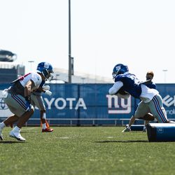 Saquon Barkley and Blake Martinez run what appears to be a “nutcracker” drill