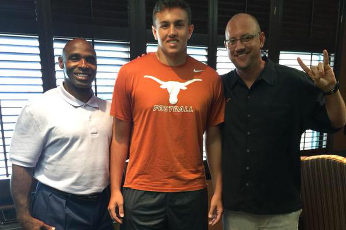 Tight end commit Peyton Aucoin posing with head coach Charlie Strong and TEs coach Jeff Traylor