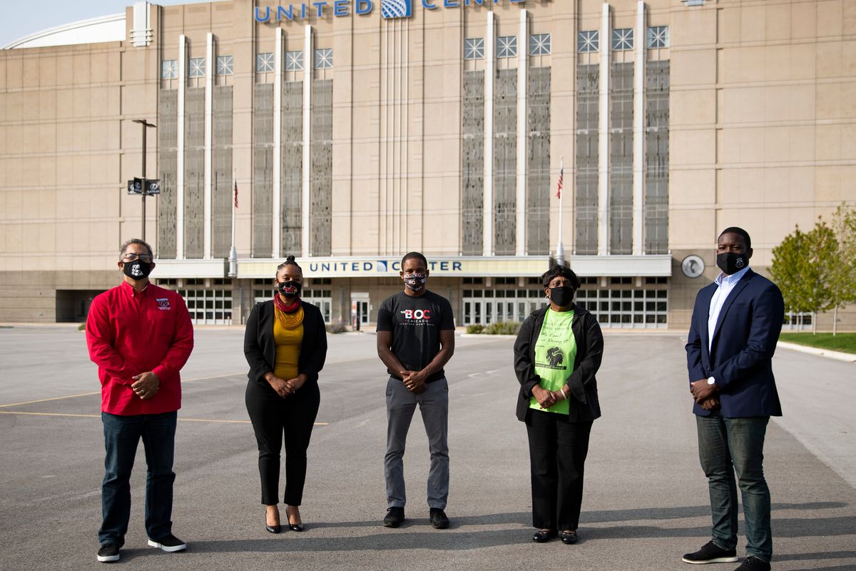 The five inaugural recipients of One West Side grants — Phil Jackson (from left), Ayesha Jaco, Jamyle Cannon, Ruth Kimble and Marshall Hatch — outside the United Center.