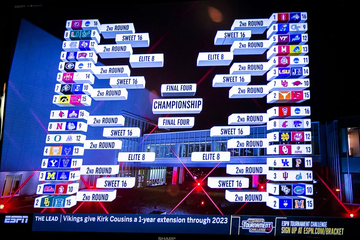 The bracket for women’s basketball teams is seen on a television screen at a NCAA Tournament Selection Sunday watch party, Sunday, March 13, 2022, at Carver-Hawkeye Arena in Iowa City, Iowa.