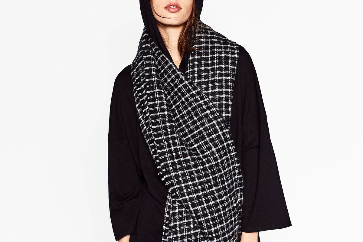 A model wearing a Zara check scarf