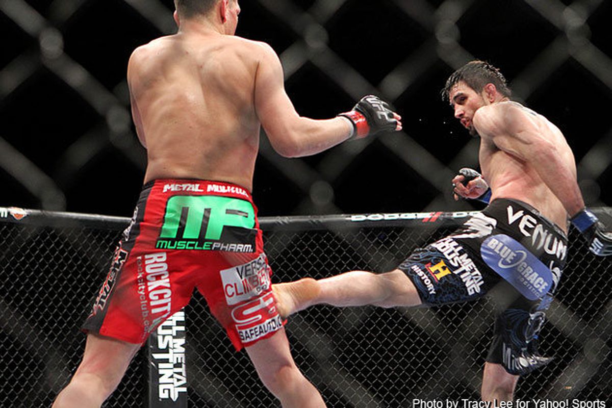 Photo of Nick Diaz (left) and Carlos Condit (right) fighting at UFC 143 on Sat., Feb. 4, 2012, at the Mandalay Bay Events Center in Las Vegas, Nevada, by Tracy Lee via Cagewriter.com.