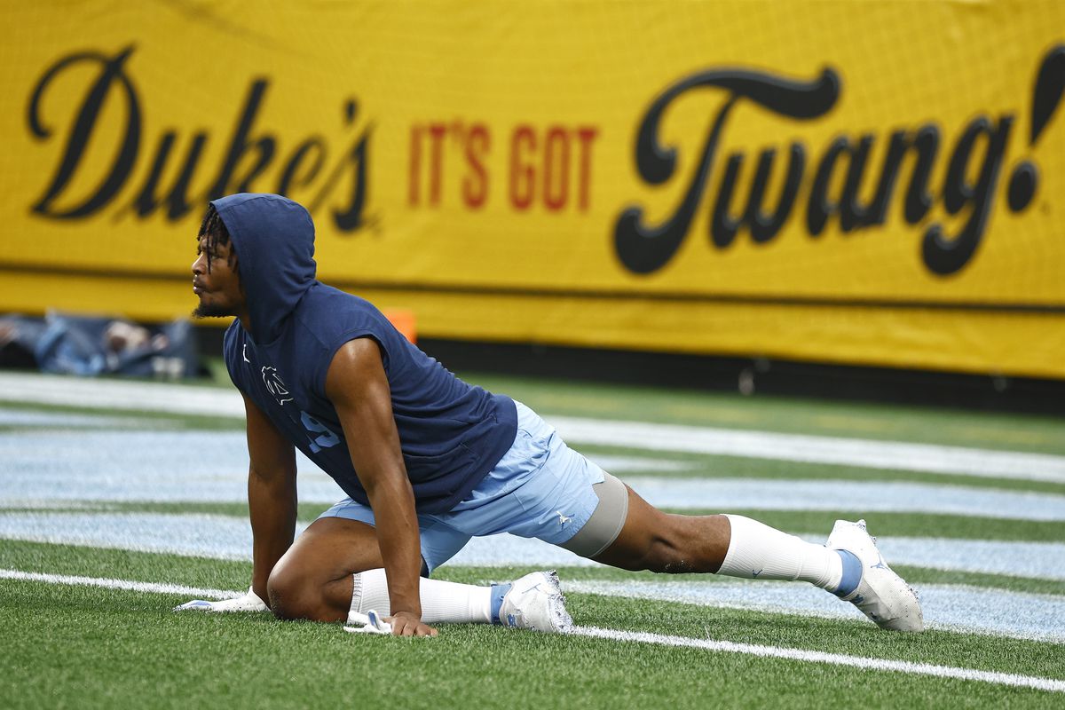 Ty Chandler of the North Carolina Tar Heels warms up prior to the Duke’s Mayo Bowl against the South Carolina Gamecocks at Bank of America Stadium on December 30, 2021 in Charlotte, North Carolina.