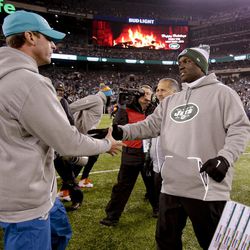 New York Jets head coach Todd Bowles, right, greets Miami Dolphins head coach Adam Gase at mid field after an NFL football game, Saturday, Dec. 17, 2016, in East Rutherford, N.J. The Dolphins won 34-13. 