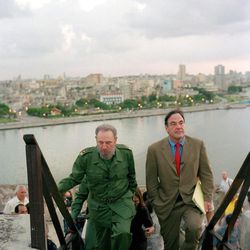 FILE - In this undated file publicity photo released by HBO, Cuba's leader Fidel Castro, left, walks with Oliver Stone during Stone's making of the HBO documentary "Looking for Fidel" in Havana, Cuba. Castro has died at age 90. President Raul Castro said on state television that his older brother died late Friday, Nov. 25, 2016. (HBO, Rose Serra via AP, File)