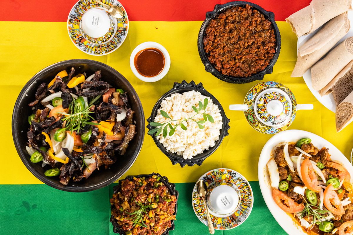 Various Ethiopian dishes are presented on a green and yellow background.