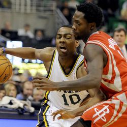 Utah Jazz point guard Alec Burks (10) tries to drive downcourt as Houston Rockets point guard Patrick Beverley (2) applies pressure during a game at EnergySolutions Arena on Monday, Dec. 2, 2013.