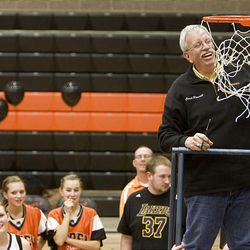 Ogden High's girls basketball coach Phil Russell celebrates his 500th win by cutting the net Thursday night.  
