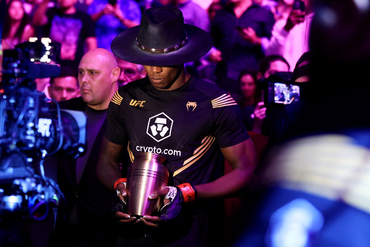 Israel Adesanya walks out as the Undertaker for his fight against Jared Cannonier at UFC 276.