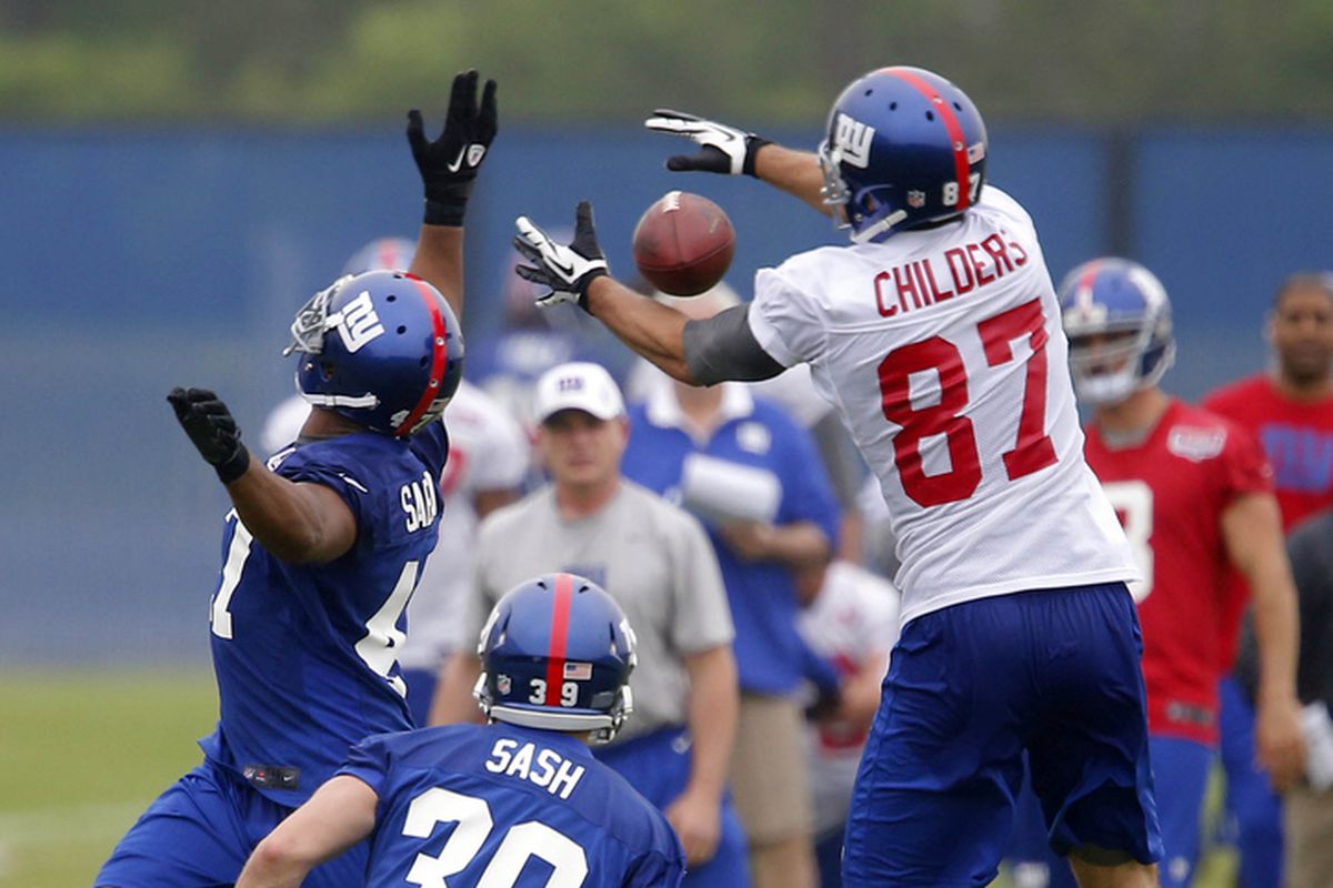 Jamie Childers tries to catch a pass during mini-camp