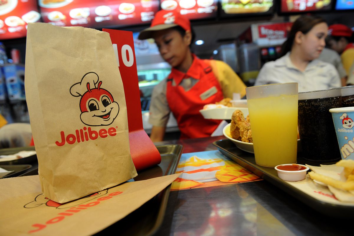 A brown paper bag emblazoned with the red mascot of Filipino fast food chain Jollibee.