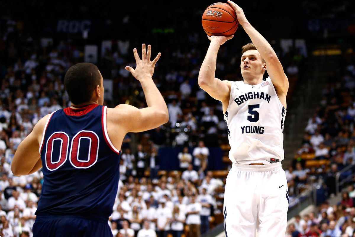 BYU's Kyle Collinsworth shoots over Saint Mary's Brad Waldow early in the second half. BYU defeated Saint Mary's 82-60 in the Marriott Center in Provo, Utah on Thursday February 12, 2015.