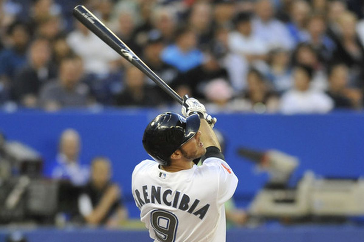 J.P. Arencibia swings on a pickoff throw to second.