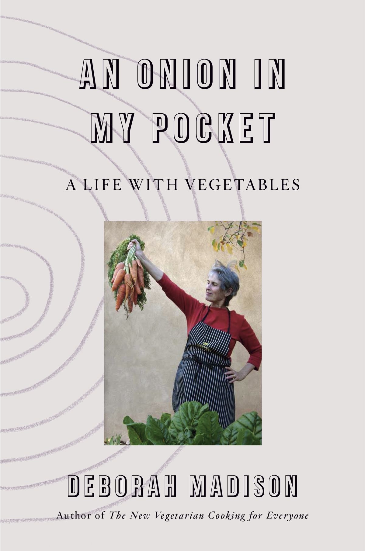 A woman holds up a bushel of carrots on the book cover for An Onion in My Pocket