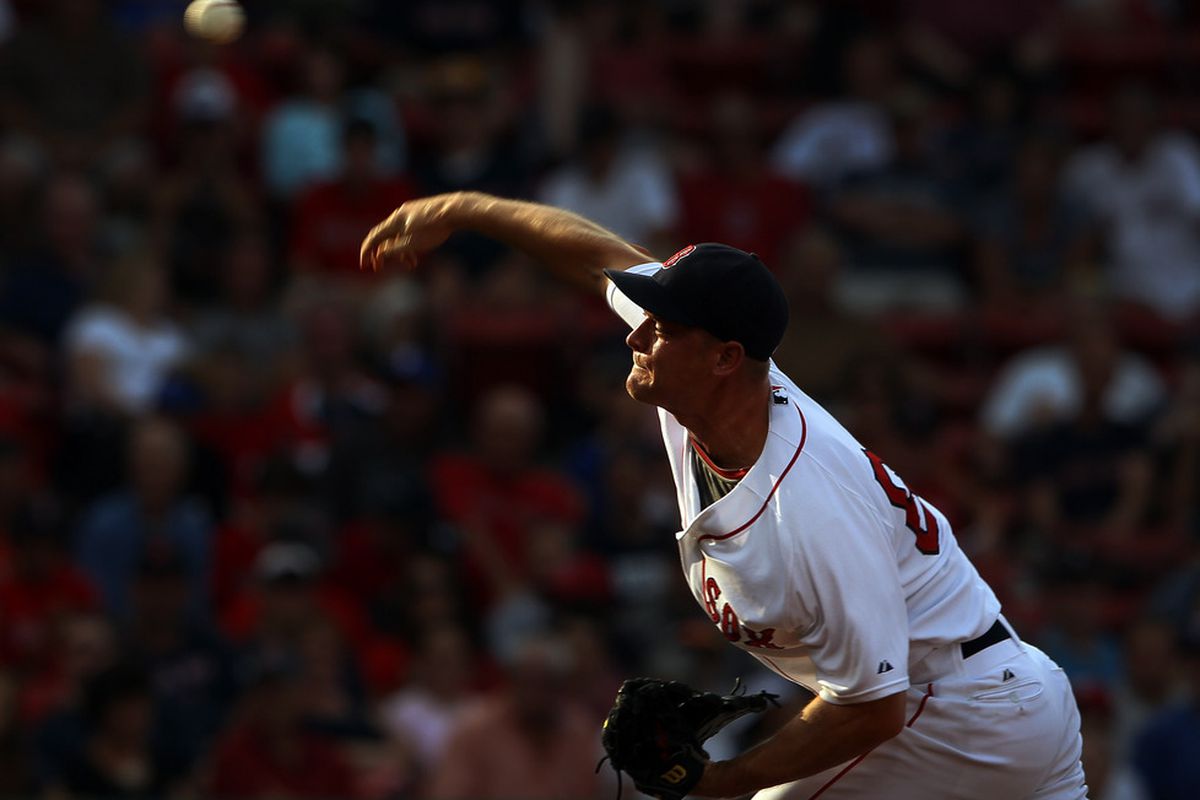 Michael Bowden of the Boston Red Sox delivers a pitch in the eighth inning against the Texas Rangers at Fenway Park in Boston, Massachusetts.  (Photo by Elsa/Getty Images)