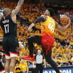 Utah Jazz guard Donovan Mitchell (45) drives on Houston Rockets forward PJ Tucker (17) during the NBA playoffs in Salt Lake City on Saturday, April 20, 2019.
