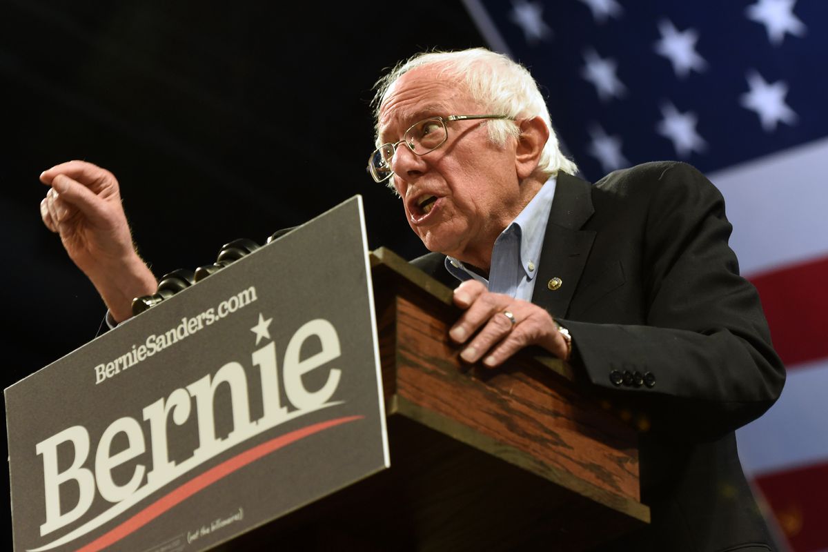 Democratic presidential candidate Bernie Sanders speaking from a podium.