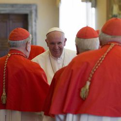 Pope Francis talks to a group of Cardinals during a Consistory at the Vatican Tuesday, March 15, 2016. Mother Teresa will be made a saint on Sept. 4. Pope Francis set the canonization date Tuesday, paving the way for the nun who cared for the poorest of the poor to become the centerpiece of his yearlong focus on the Catholic Church's merciful side. 
