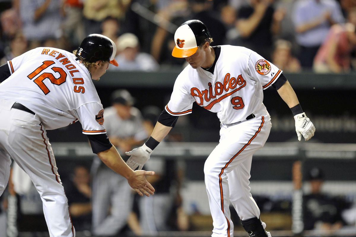 August 27, 2012; Baltimore, MD, USA; Baltimore Orioles left fielder Nate McLouth (9) runs the bases after hitting a two-run home run in the eighth inning against the Chicago White Sox at Oriole Park at Camden Yards. 