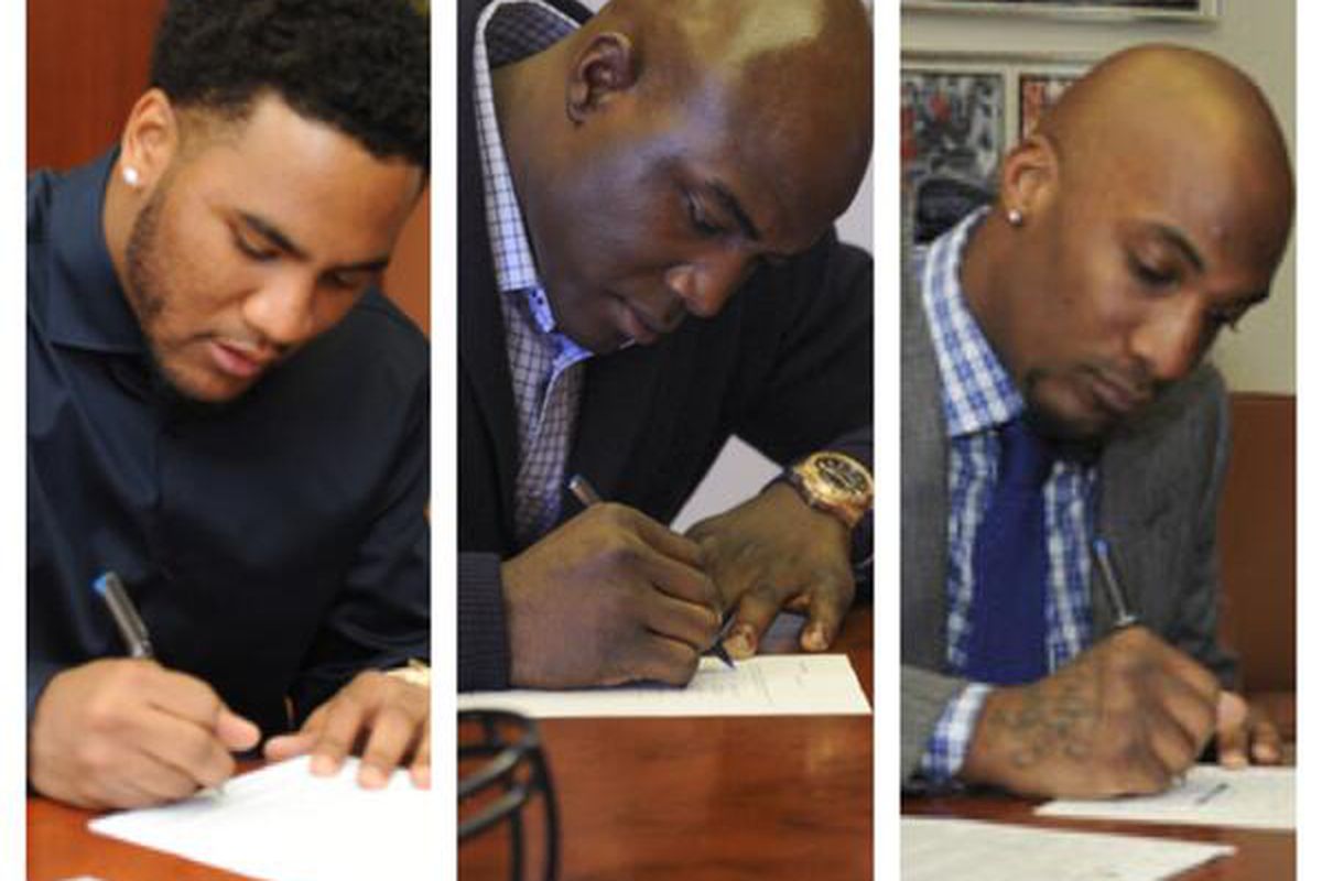 Broncos 2014 free agent signings T.J. Ward, DeMarcus Ware, and Aqib Talib