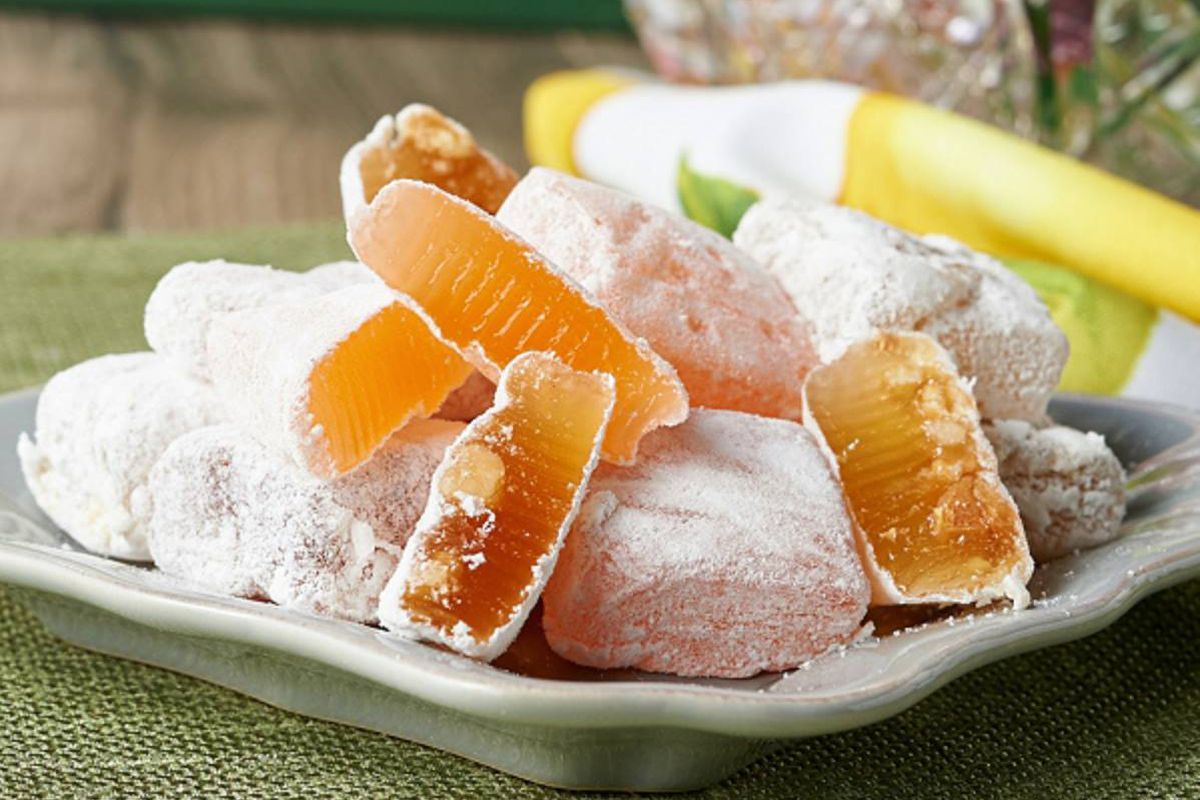 A few of powder sugar-coated Cotlets, a jellied confection made from apricots