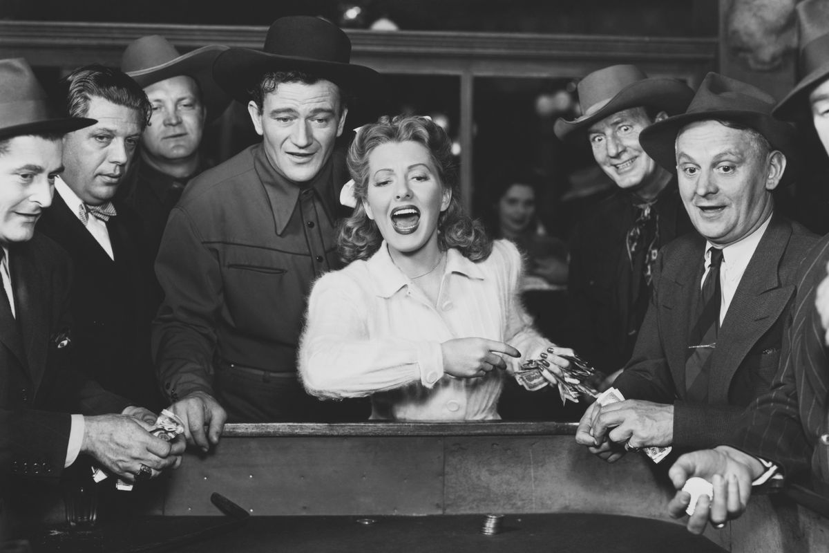 Jean Arthur and John Wayne in A Lady Takes a Chance