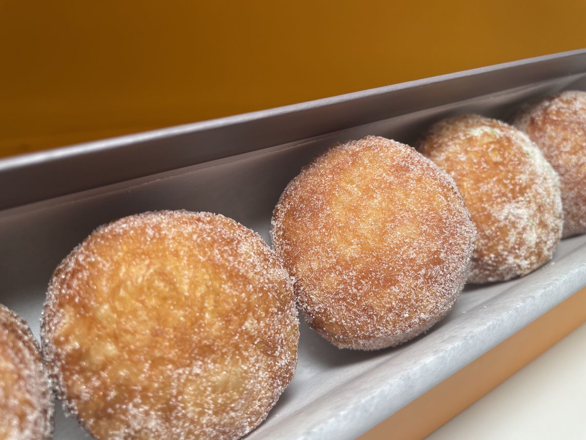 A box of round doughnuts.