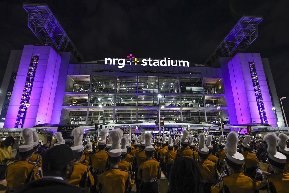 The LSU Marching Band marches outside the stadium before the LSU Tigers play against the Kansas State Wildcats in the 2022 Texas Bowl at NRG Stadium.
