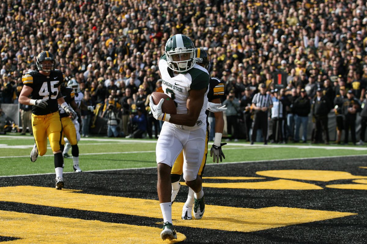IOWA CITY, IA - NOVEMBER 12:   B. J. Cunningham #3 of the Michigan State Spartans scores a touchdown against the Iowa Hawkeyes at Kinnick Stadium November 12, 2011 in Iowa City, Iowa.  (Photo by Reese Strickland/Getty Images)