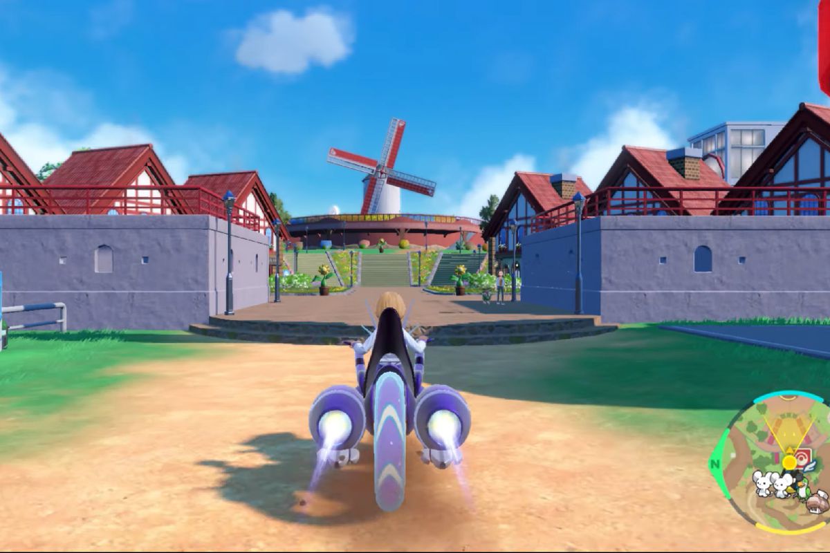 A Pokemon trainer riding a Miraidon into a European village. The mini map on the bottom right shows three new Pokemon.