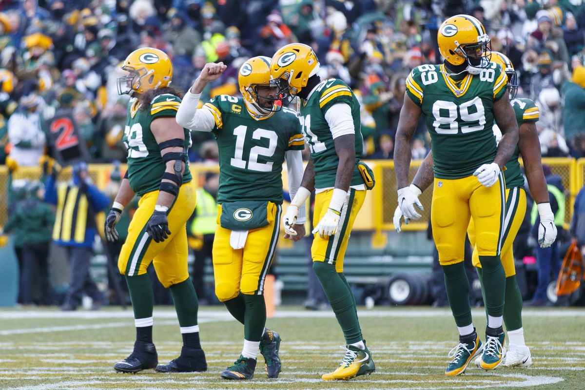 Green Bay Packers quarterback Aaron Rodgers celebrates with wide receiver Davante Adams following a touchdown during the third quarter against the Chicago Bears at Lambeau Field.