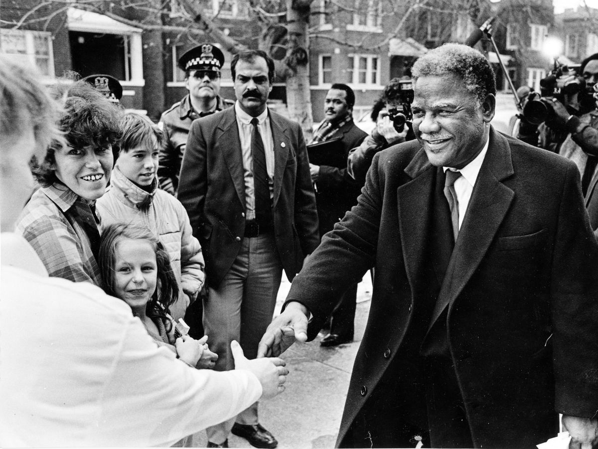 Mayor Harold Washington shakes the hands of students at Weber High School. He was there to greet citizens outside Weber for a mayoral forum.<br>| Sun-Times File Photo