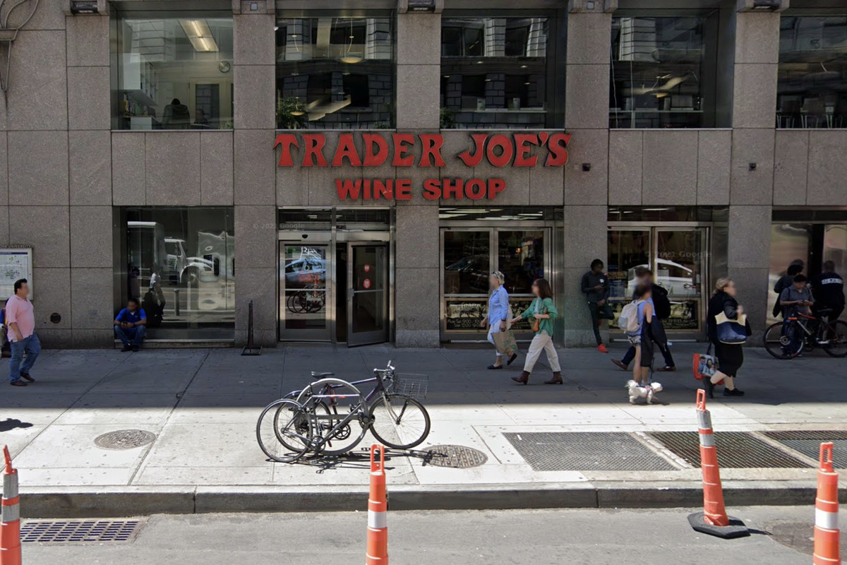 Customers walk in front of a Trader Joe’s wine shop in Union Square, Manhattan.