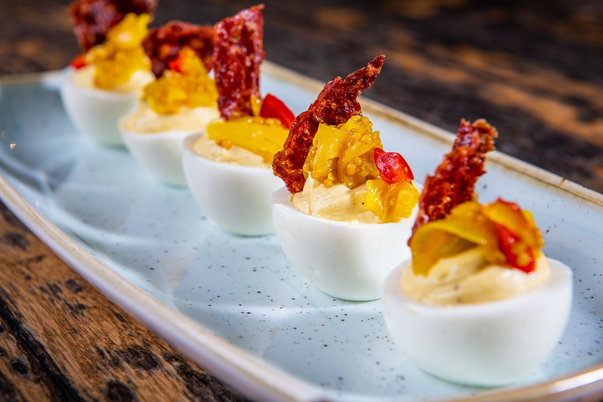 Deviled eggs with chow chow and a shard of crispy soppressata from Glover Park Grill