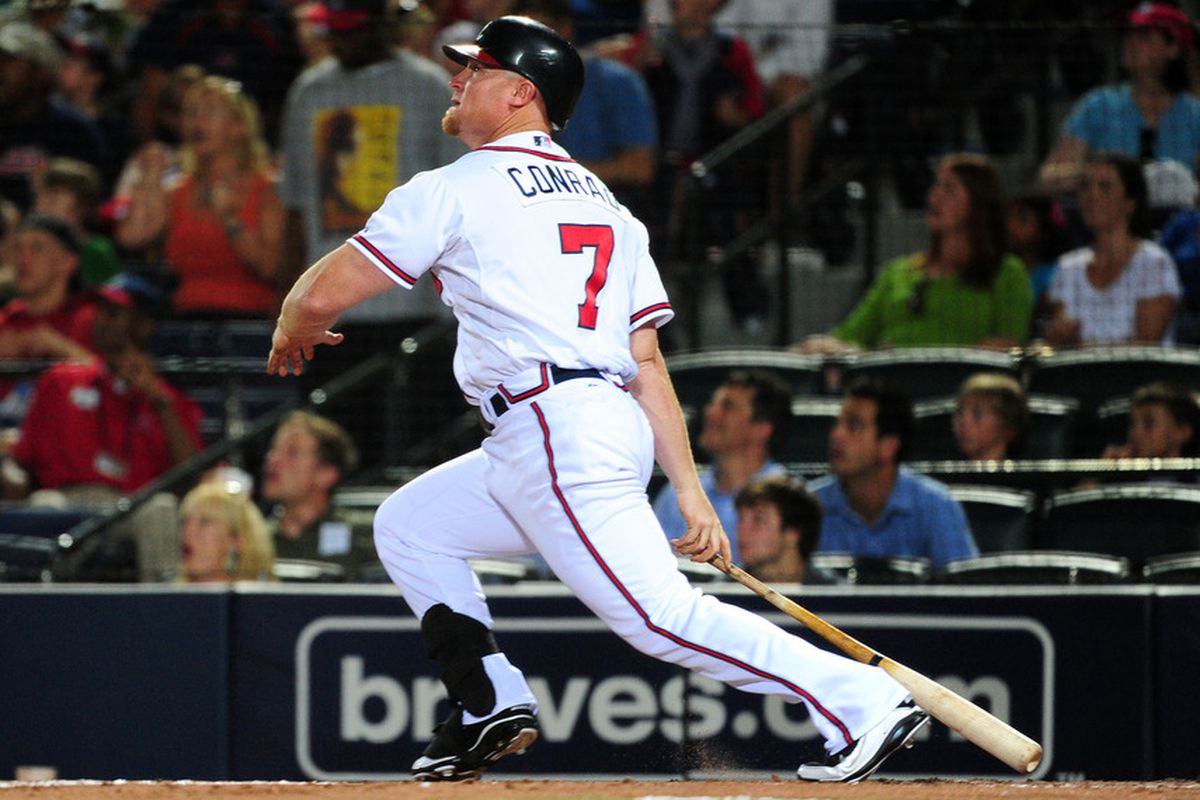 Brooks Conrad of the Atlanta Braves hits a 9th inning home run against the New York Mets at Turner Field on June 16, 2011 in Atlanta, Georgia. 