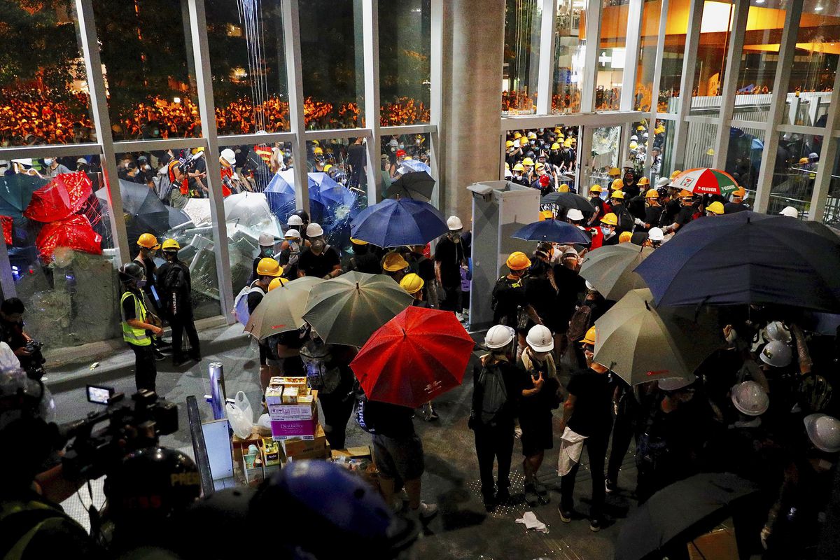 Protesters force themselves inside the legislative building in Hong Kong on July 1, 2019.