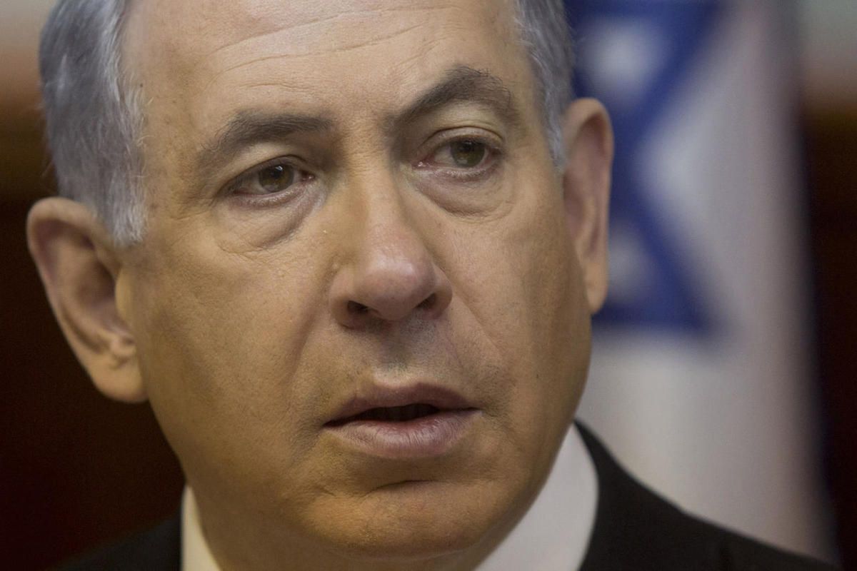 In this Feb. 8, 2015 file-pool photo, Israeli Prime Minister Benjamin Netanyahu attends the weekly cabinet meeting in his Jerusalem office. A group of almost two dozen liberal Democrats have signed a letter to House Speaker John Boehner asking him to post