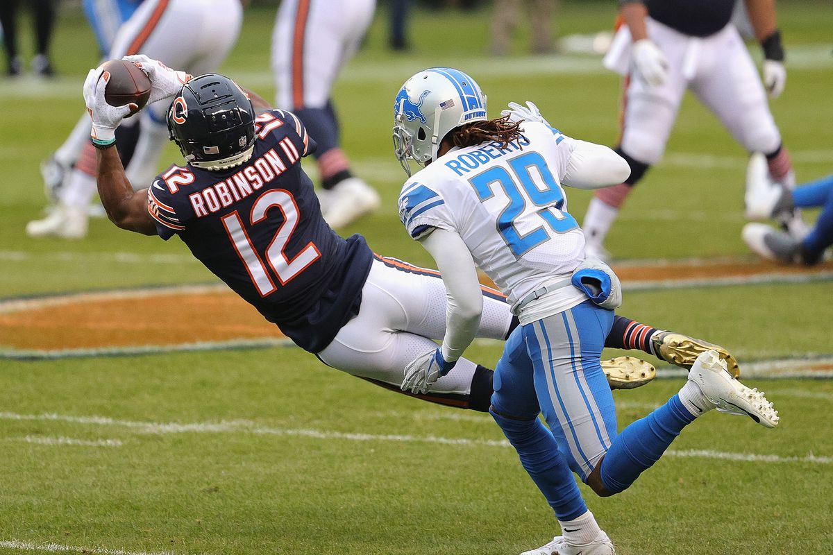 Allen Robinson #12 of the Chicago Bears catches a pass in front of Darryl Roberts #29 of the Detroit Lions at Soldier Field on December 06, 2020 in Chicago, Illinois. The Lions defeated the Bears 34-30.